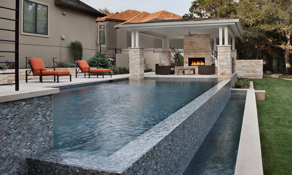 Home 1 a swimming pool with a fireplace