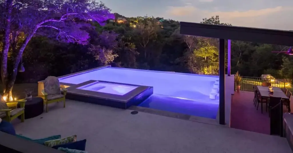 infinity pool, spa, lighting, fire feature concept of Discover Austin's Premier Swimming Pool Construction